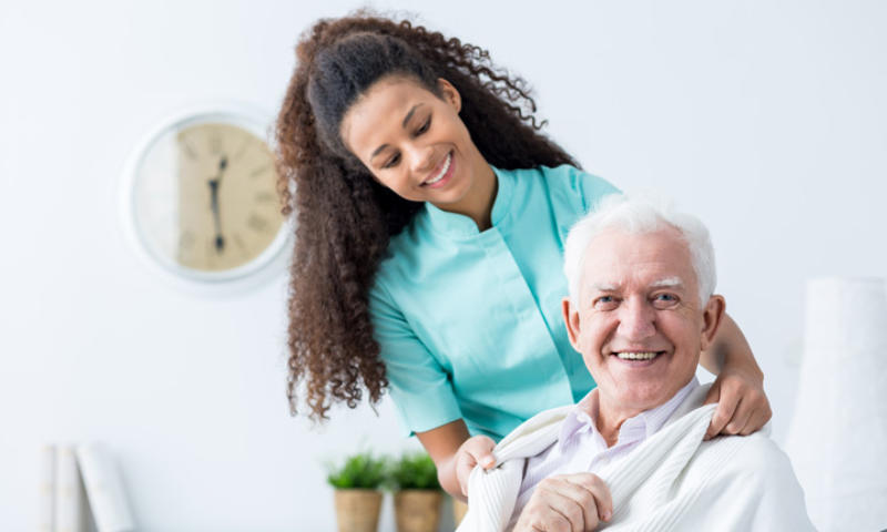 Improved Healthcare. Nurse with patient in arm sling.